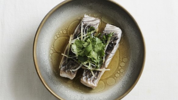 Steamed barramundi fillets with white soy, ginger and spring onions.