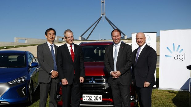 Mitsubishi CEO Mutsuhito Oshikiri, Minister for Urban Infrastructure Paul Fletcher, Minister for Environment and Energy Josh Frydenberg and AGL CEO Andy Vesy during an electric car event on the front lawn of Parliament House in Canberra on Monday 22 May 2017. fedpol Photo: Alex Ellinghausen