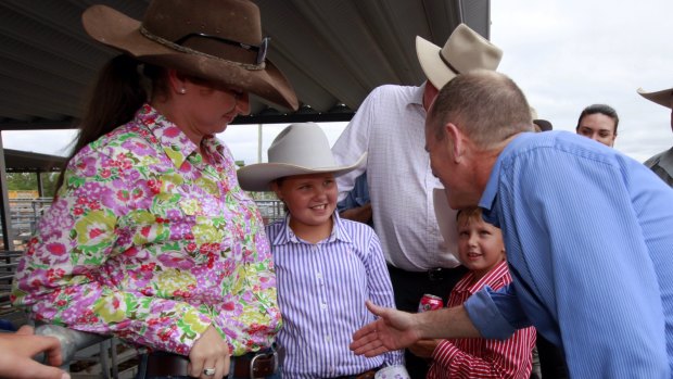 Premier Campbell Newman greets some young locals.