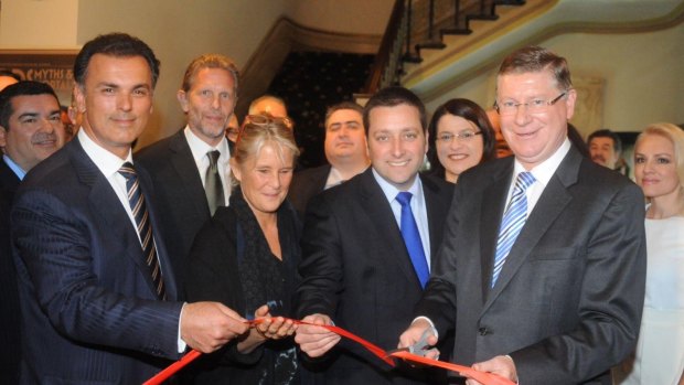 Millionaire property developer Harry Stamoulis (left) in 2014 with then planning minister Matthew Guy and then premier Denis Napthine (right) at the opening of the  Gods, Myths & Mortals exhibition at the Hellenic Museum in Melbourne.