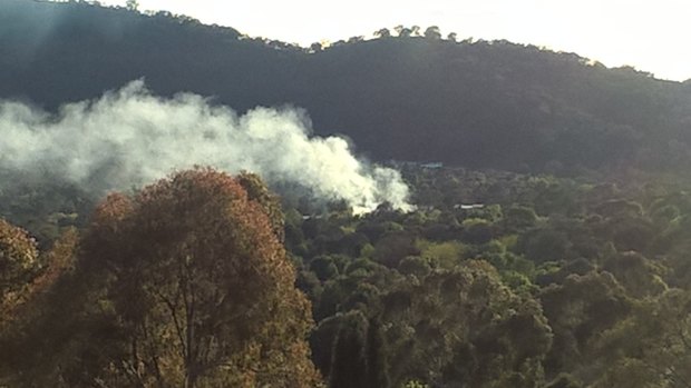 Smoke emanating from a controlled burn at Lanyon High School in Conder in Canberra's southern suburbs.