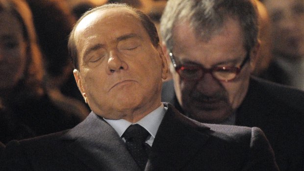 Former Italian Premier Silvio Berlusconi, foreground, who praised Benito Mussolini for "having done good".