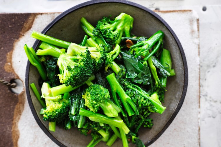 Three broccolis in garlic oil.