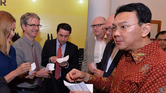 Australian journalists and the country's ambassador to Indonesia, Paul Grigson (right, in beige jacket), with Jakarta governor Basuki Tjahaja Purnama (right), known by his nickname, Ahok, at Jakarta city hall in March. 