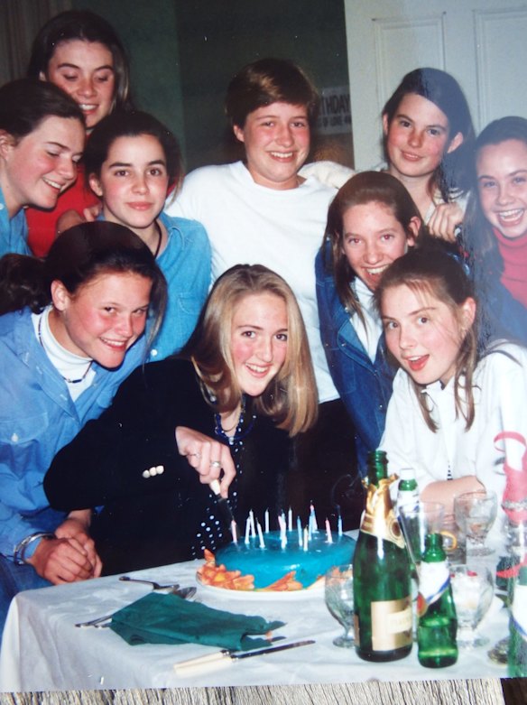 Bee Alexander, far left in middle row, at a surprise party for Katrina Dawson who is cutting the cake on her 15th or 16th birthday.