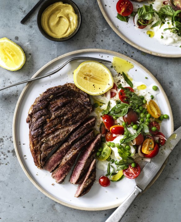 Seared scotch fillet with mozzarella, peas and cherry tomatoes.