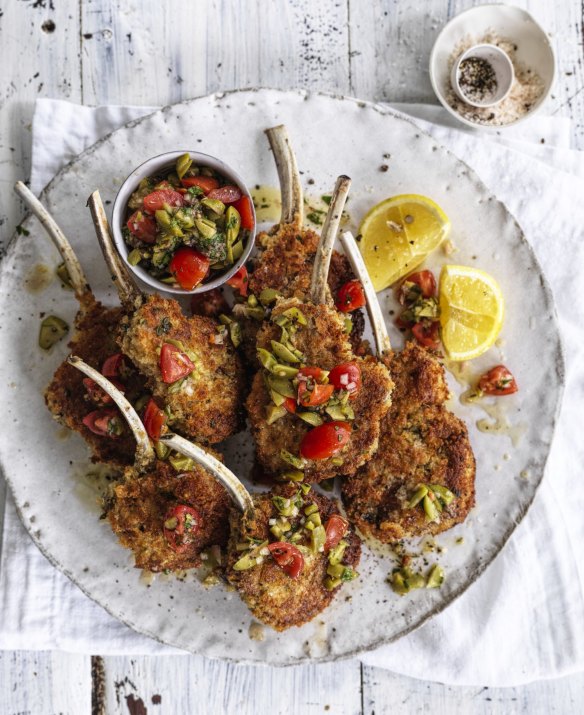 Parmesan-crumbed lamb cutlets with tomato and olive salsa.