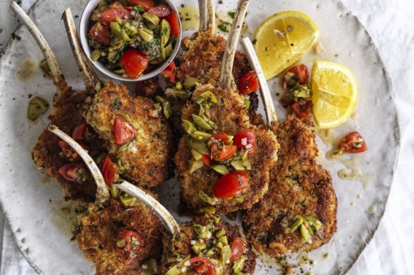 Parmesan-crumbed lamb cutlets with tomato and olive salsa.