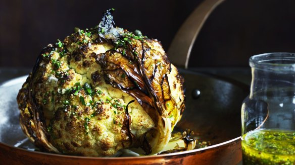 The trick to successfully roasting a whole cauliflower is to increase the humidity.