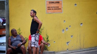 Bullet holes are seen on a wall in Rio's Complexo do Alemao favela.
