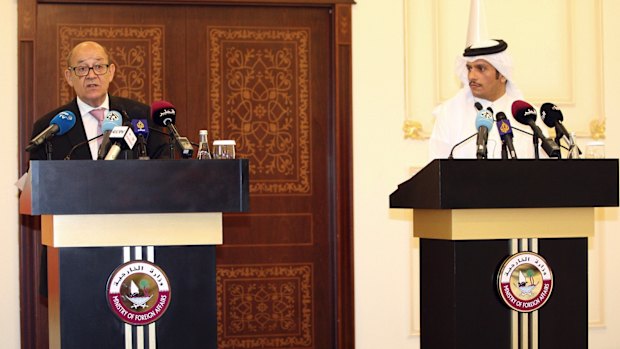 French Foreign Minister Jean-Yves Le Drian, left, at a news conference with his Qatari counterpart Mohammed bin Abdulrahman al-Thani in Doha.