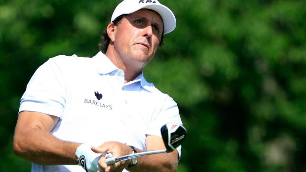 Phil Mickelson said he reached an agreement with the market regulator to return proceeds of nearly $US1 million ($1.4 million) from the trades. 