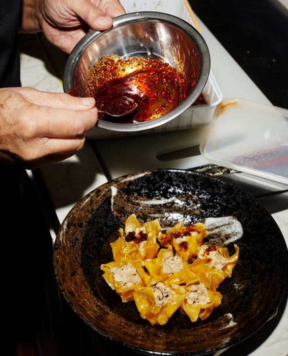 Tan dressing dumplings at his cooking school.