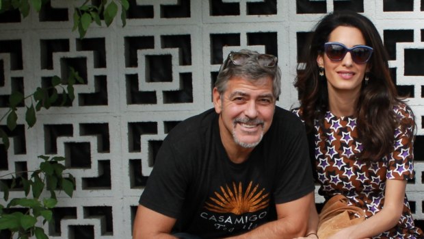 "How can one man be so lucky?" says George Clooney, pictured here with UN lawyer, his wife Amal.