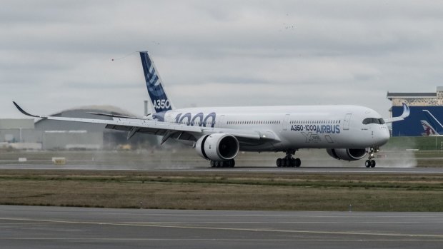 The Airbus A350-1000 lands following its first flight.