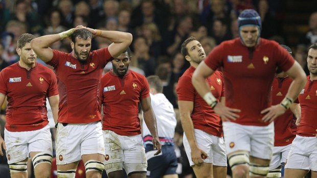 Sad end: French players react after New Zealand's Julian Savea scored a try during the quarter-final  at the Millennium Stadium.
