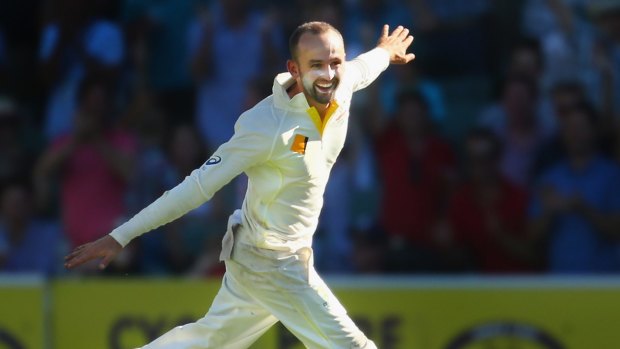 That's the match: Nathan Lyon is all smiles after taking the final wicket.