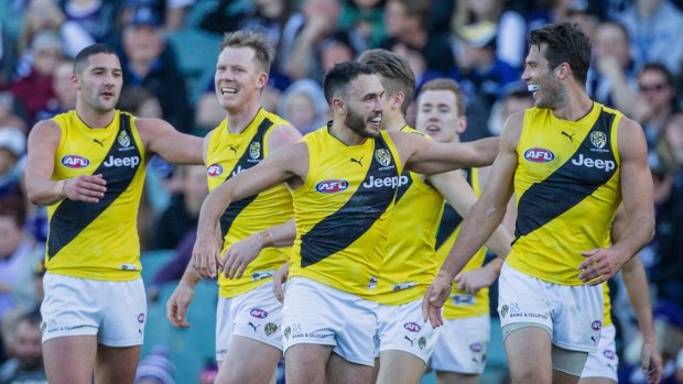 On the up: Tigers celebrate a big win over Freo at Domain Stadium in Perth.