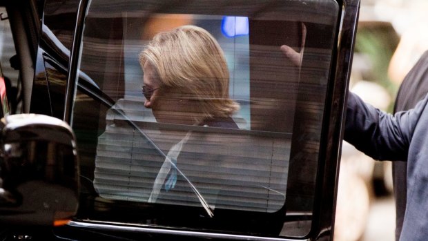Democratic presidential candidate Hillary Clinton gets into a van as she leaves her daughter's apartment.