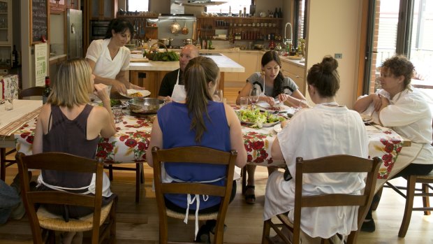 Patrizia Simone's Country Cooking School with Patrizia at head of table on right.
