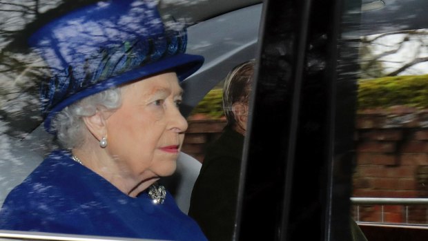 Queen Elizabeth II arrives with Prince Philip for the morning church service 