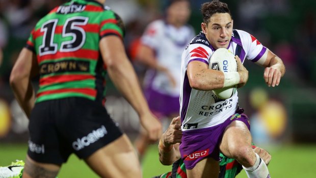 Elusive: Billy Slater breaks free from the Bunnies.