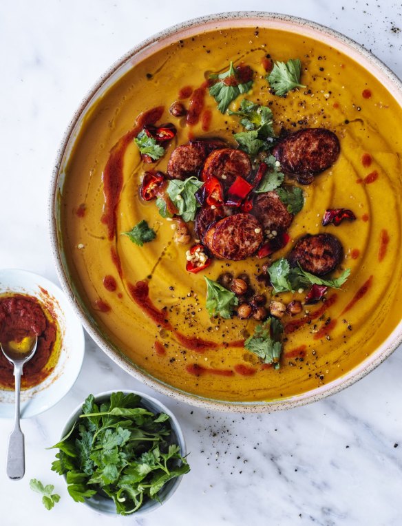 Roast pumpkin soup with merguez sausage, chilli, chickpeas and a swirl of rose harissa.