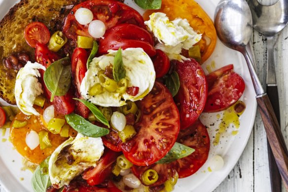 Karen Martini chops the tomatoes into different sizes for textural variety.