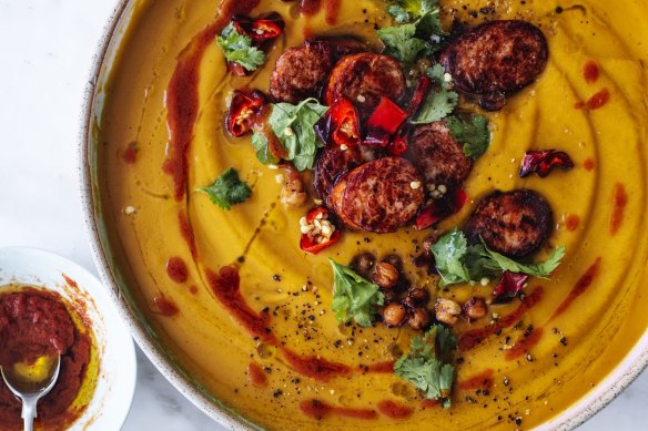 Roast pumpkin soup with merguez sausage, chilli, chickpeas and a swirl of rose harissa.