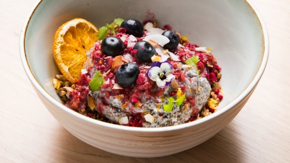 Chia pudding with freeze-dried raspberries, maple buckwheat and fruit.