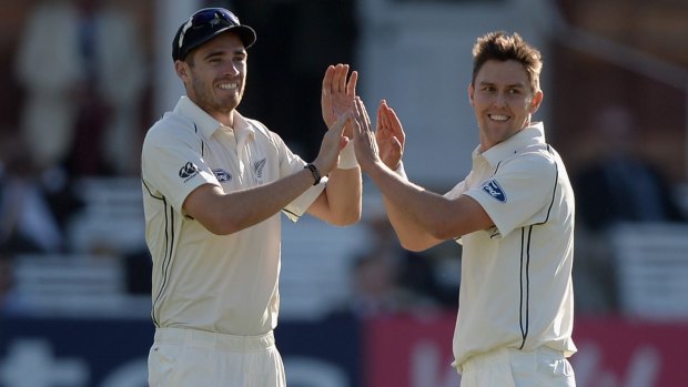 Trent Boult and Tim Southee celebrate a wicket during the tour of England.