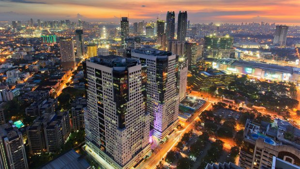 The bright lights of night-time Manila.