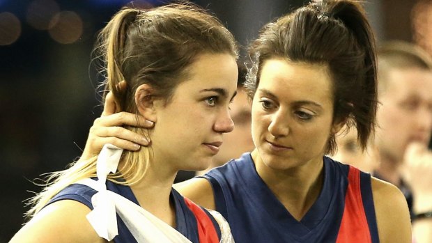 Heartache: an injured Chloe Molloy (left) is consoled by Steph Chiocci.