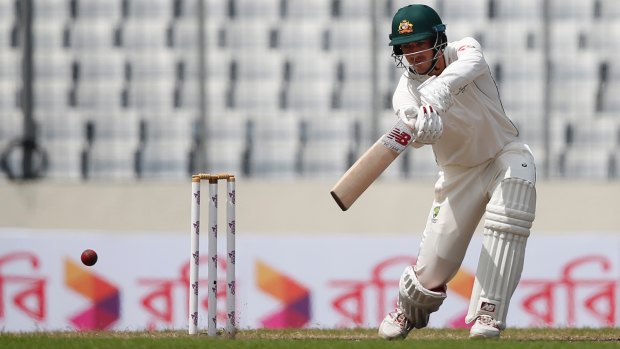 Australia's Pat Cummins, who batted well, plays a shot during the second day of the first Test against Bangladesh in Dhaka.