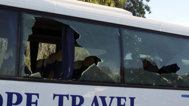 A damaged bus is seen after the attack.
