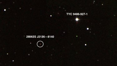 A photograph captures the planet 2MASS J2126-8140, in orbit around its host star TYC 9486-927-1.