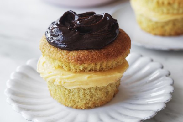 Boston cream cupcakes sandwiched with whipped coconut custard.