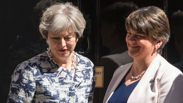 Britain's Prime Minister Theresa May outside 10 Downing Street with DUP leader Arlene Foster.