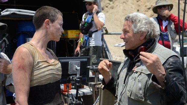 George Miller on the set of <i>Mad Max: Fury Road</i> with Charlize Theron.