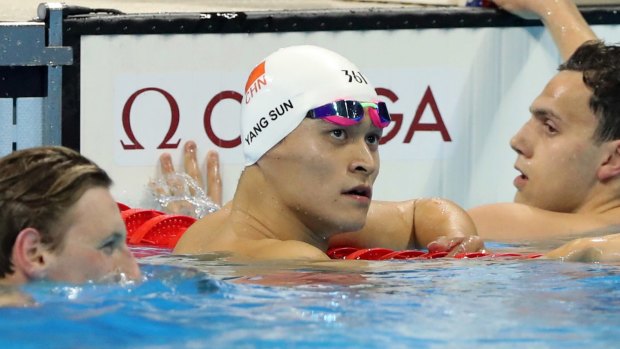 China's Sun Yang, centre, looks up after winning the silver medal.