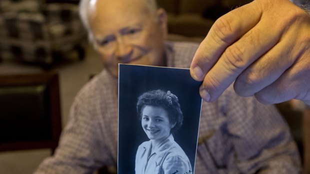 Norwood Thomas, holds up a photo of wartime sweetheart Joyce Morris at his home in Virginia Beach, Virginia. The pair have just been reunited in Adelaide after more than 70 years apart.