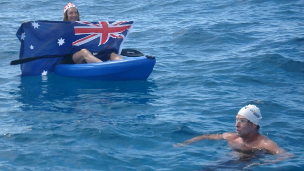 A fan displays an Australian flag during Pete Tanham's 2014 Rottnest Swim. 