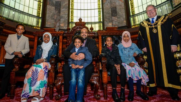 Joining Abubeker Mohamed and Lord Mayor Robert Doyle at the ceremony are his family Abdullah, Nusayba, Osama, Mohamed and Hajer.