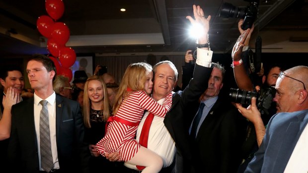 Bill Shorten with daughter Clementine depart Labor's election-night function.