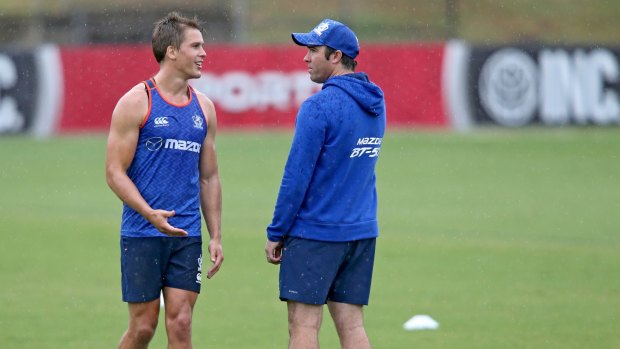 Preparation: Andrew Swallow with coach Brad Scott at Arden Street on Friday.