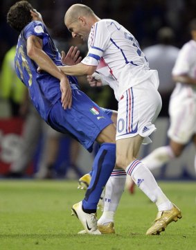 Marco Materazzi falls under Zinedine Zidane's headbutt in 2006.