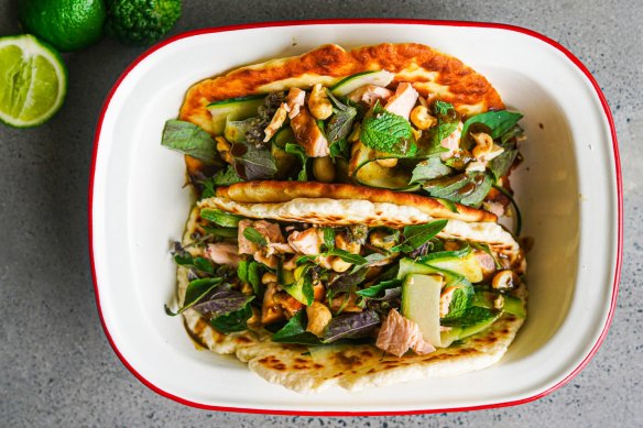 Flatbread piled with flaked hot smoked salmon, coriander dressing, cucumber, herbs and cashews.