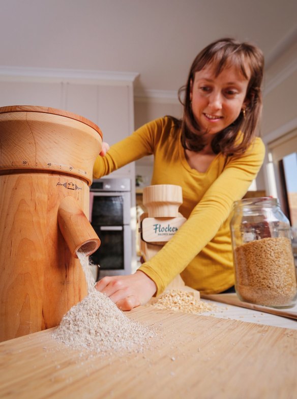 Nerida Thompson mills wholegrain wheat at home. 