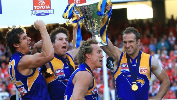 Andrew Embley, Ben Cousins, Daniel Chick and Chris Judd lift the 2006 Premiership Cup.