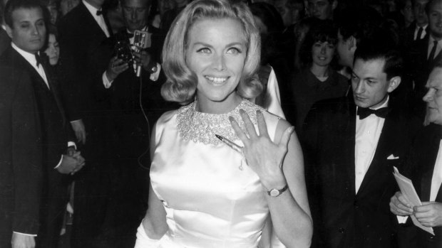 Bond girl Honor Blackman wears Charles de Temple gold on her left hand at the 1964 London premiere of Goldfinger.